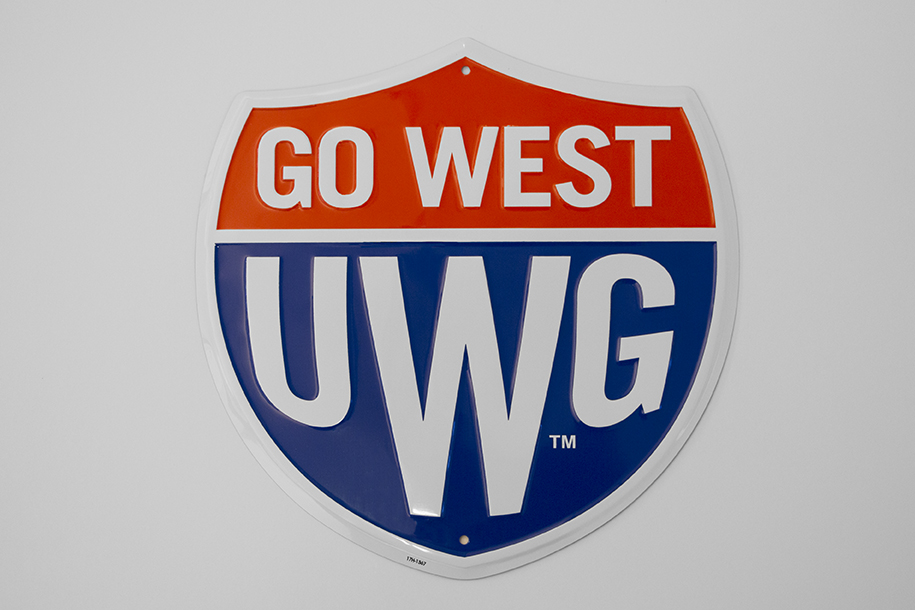 Sign: Go West Shield Alumni