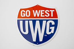 Sign: Go West Shield Alumni